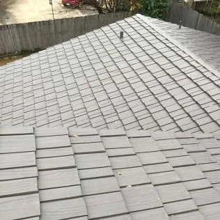 Residential home with a finished shingle roof